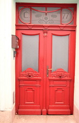 Obraz premium old antique door in red no people stock image stock photo
