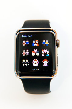 PARIS, FRANCE - APR 4, 2015: Homosexual and hetereosexual families emojy on the Apple Watch digital screen clock face