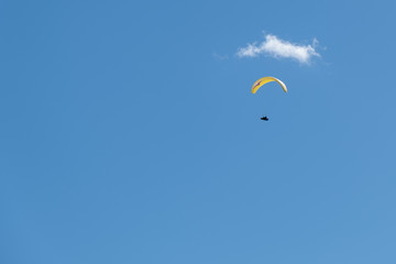 Paraglider below small cloud in the sky, nobody, copy space