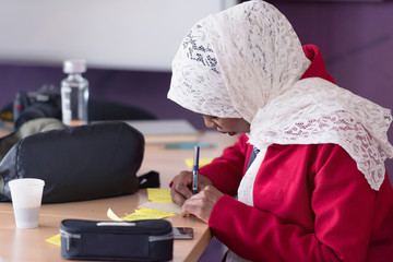 Obraz premium Startup business african american woman working everyday job at modern coworking office space looking at innovative project. Using digital technologies.