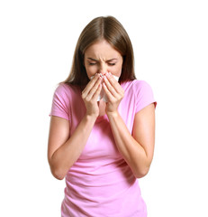 Young woman suffering from allergy on white background