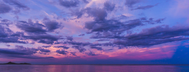 Fototapeta na wymiar Colorful sky after the sunset on the beach