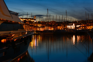 The marina and beautiful cityscape with yachts, Cannes, France