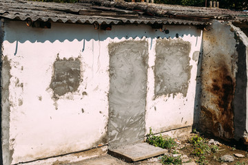 Slum, old ruined houses in poverty neighborhood