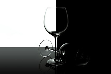 Empty wine glasses for wine isolated on black and white background. Wine list design menu with copy space. Alcohol beverage card backdrop.