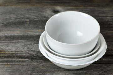  White ceramic bowls on wooden background