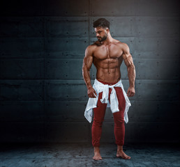 Muscular Men in Red Jeans with white shirt around his hips