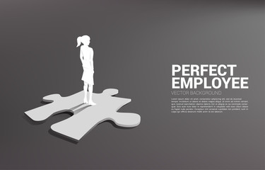 Silhouette of businessman standing on final jigsaw piece. Concept of perfect recruitment. Human Resource. put the right man on the right job.