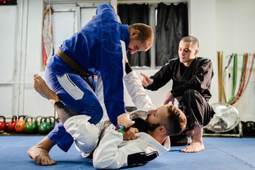 Brazilian JIu Jitsu BJJ private class professor of the martial arts academy working on the...