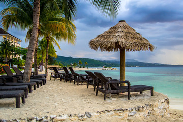 Jamaican beach by turquoise water