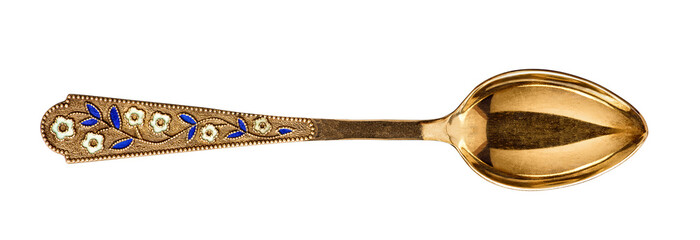 Vintage gold spoon with a pattern of flowers and enamel on an isolated white background