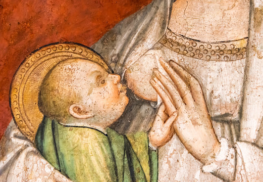 Detail of medieval painting showing Mary breast feeding baby Jesus