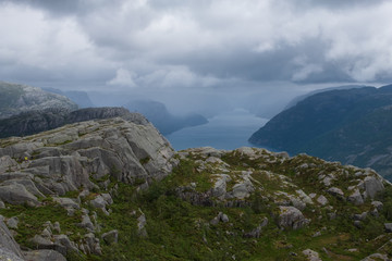 Preikestolen massive cliff (Norway, Lysefjorden summer morning view). Beautiful natural vacation hiking walking travel to nature destinations concept. July 2019