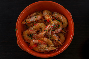 Grilled shrimp, Portuguese style with crushed chili peppers, garlic and parsley at an al fresco restaurant in Porto
