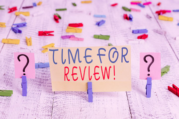 Writing note showing Time For Review. Business concept for formal assessment of something with intention instituting change Crumbling sheet with paper clips placed on the wooden table