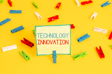 Text sign showing Technology Innovation. Business photo text significant technological changes of products Colored clothespin papers empty reminder yellow floor background office