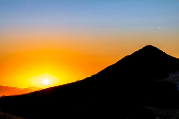 Hill Silhouetted at Sunset 