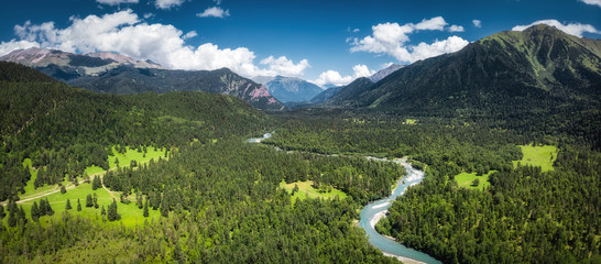 Panoramic nature mountains landscape in the summer day. Aerial drone view from above
