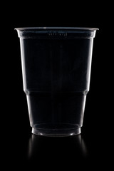 Disposable plastic cup isolated on black background