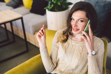 Woman In Cafe, Talking On Phone, Working On Notebook