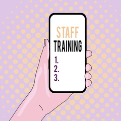 Conceptual hand writing showing Staff Training. Concept meaning program that helps employees learn specific knowledge Closeup of Smartphone Device Held in Hand and Text Space