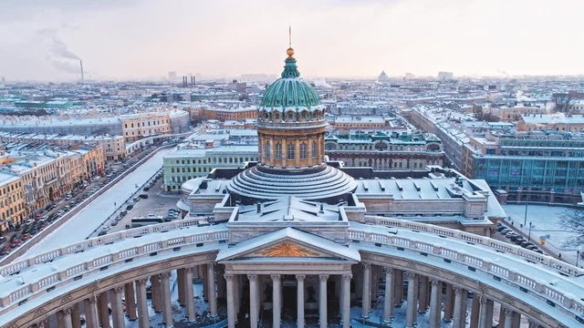 Flying birds and Snowfall on a sunny day over the Kazan Cathedral, located in the historical center of St. Petersburg