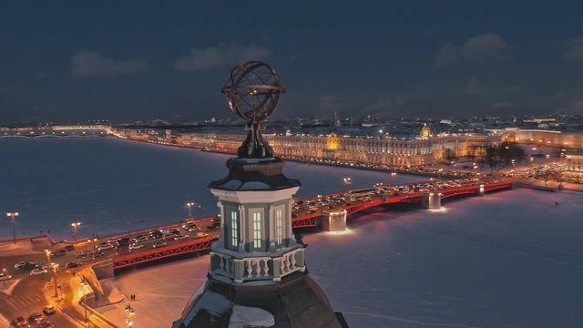 Night aerial view of the Dome of the Kunstkamera on the University Embankment, in the background - frozen Neva river, Palace Bridge and Hermitage. Saint Petersburg, Russia