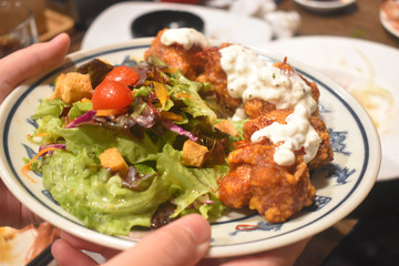 Fried chicken with vegetables salad dressing delicious Japanese food style. 