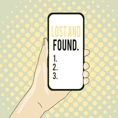 Conceptual hand writing showing Lost And Found. Concept meaning a place where lost items are stored until they reclaimed Closeup of Smartphone Device Held in Hand and Text Space
