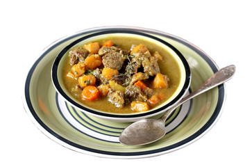 thick soup with pumpkin and beef. hearty autumn dish. isolated photo