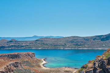                     Blue lagoon with rocks on a background in Crete, Greece. Copy space.          