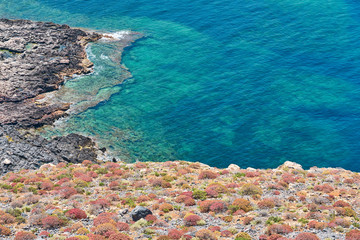                                Rocky sea coast with blue sea water in Crete, Greece. Copy space.