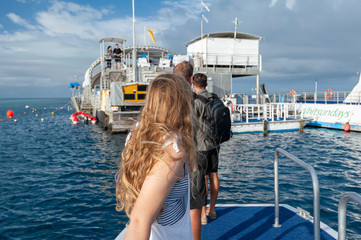 Tourists on transfer boat to Reef World on Great Barrier reef © Andrew Atkinson