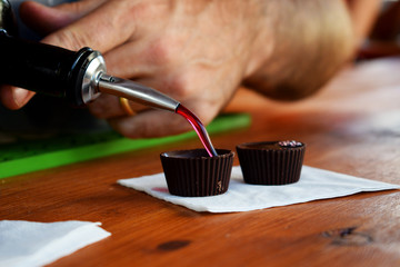 Chocolate cup filled with ginja,  traditional cherry liquor