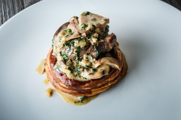 closeup homemade julienne with mushrooms and sauce