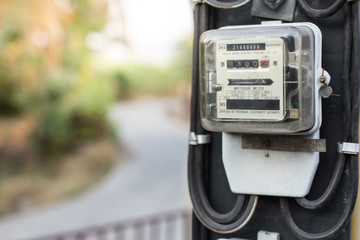Close up of electric meters onl blurred background