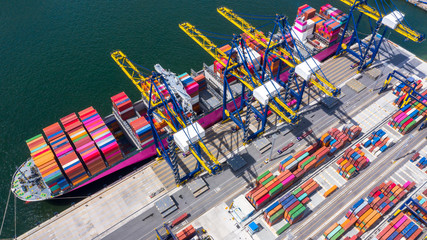 Aerial top view of logistic import export transportation business, industrial port with containers.