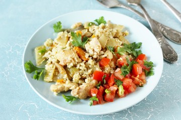 chicken pilaf and cauliflower rice. keto recipe. low carbohydrates, lots of protein. protein nutrition. stewed with celery and carrots.