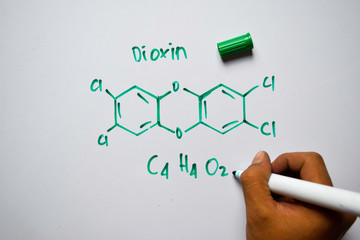 Dioxin (C4,H4,O2) molecule written on the white board. Structural chemical formula. Education concept - obrazy, fototapety, plakaty