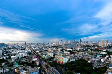 Fotobehang photos of modern city  and tall buildings in Bangkok in the evening © Photo Sesaon