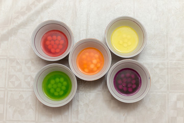 multi-colored sweets dissolve in water, all paints and harmful substances fall into the water, it is dangerous for children and for humans