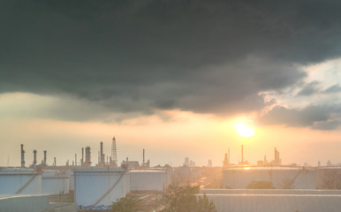 Close up Aerial view at oil and gas industrial,Oil refinery plant form industry,Refinery factory and oil storage tank with sunset