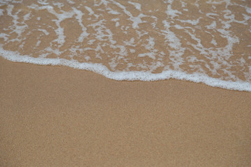 Beach sand and ocean waves