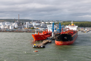 Fototapeta premium Tank farm in Gothenburg Sweden, cargo ships are in dock to load or unload their freight