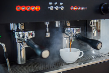 Espresso pouring from coffee machine, Coffee on espresso machine, Coffee from professional coffee machine