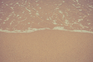 Beach sand and ocean waves