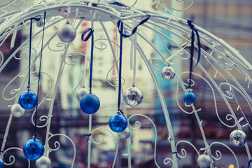 Christmas balls hanging on ribbon with bokeh