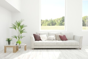 Stylish room in white color with sofa and summer landscape in window. Scandinavian interior design. 3D illustration