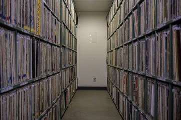 Large collection of vinyl and cassettes at a radio station storage