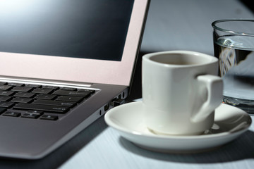 Cup of coffee on table, white cup, office desk, business area, coffee break office